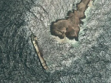 Oman says the oil spill from a grounded tanker has reached its coastline