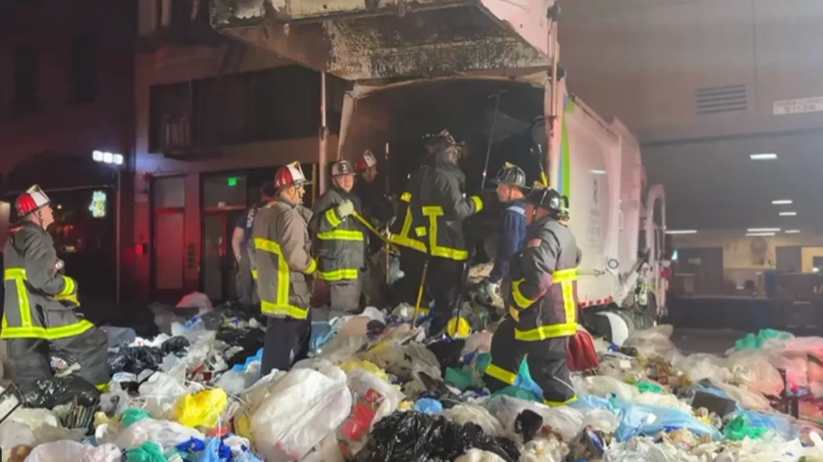 25 firefighters spend 2+ hours digging man out of compacted garbage truck load