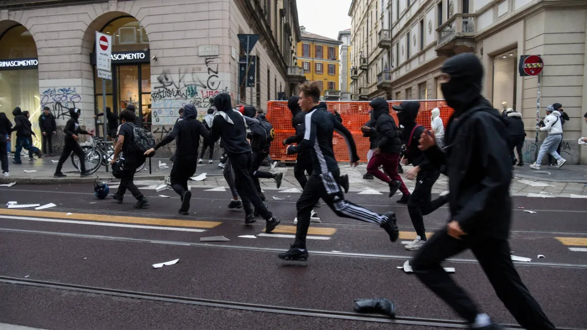 Milan on edge: Protesters clash with cops, smash windows; videos show chaos