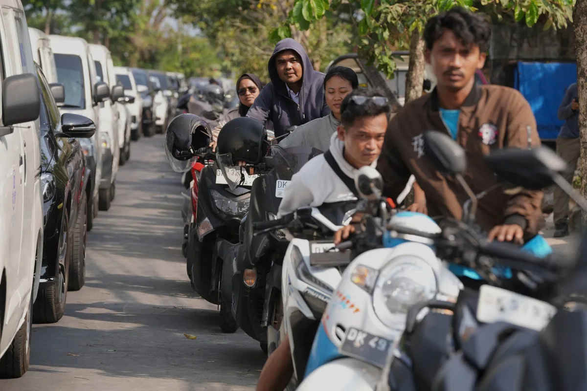 ‘This is really a waste of time’: Bali drivers queue for hours for fuel as Indonesia blames a tanker delay, bad weather and panic-buying