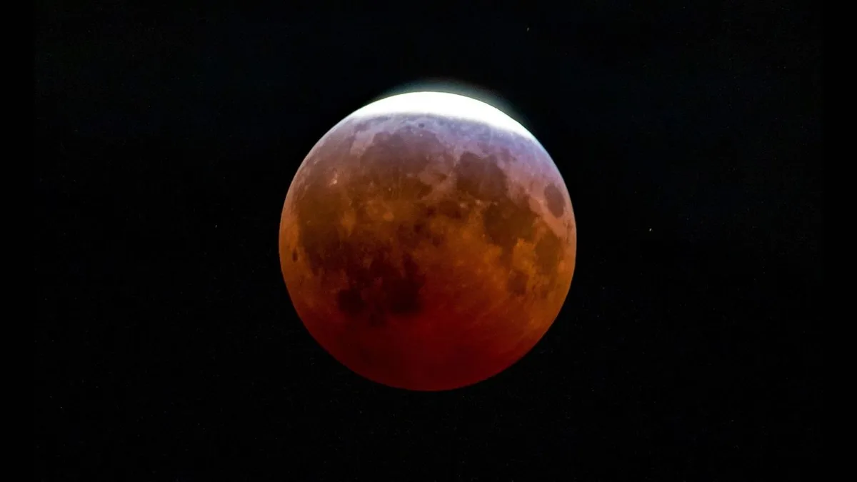 Partial lunar eclipse stuns skywatchers with an ‘almost blood moon’. Here are the best photos