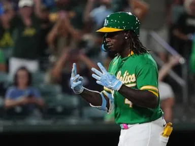 Butler homers and Williams hits a 2-run triple as the Athletics beat the Twins 7-4