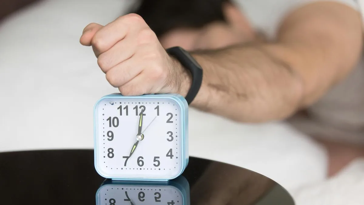 Why do we sometimes wake up a few minutes before our alarm rings?