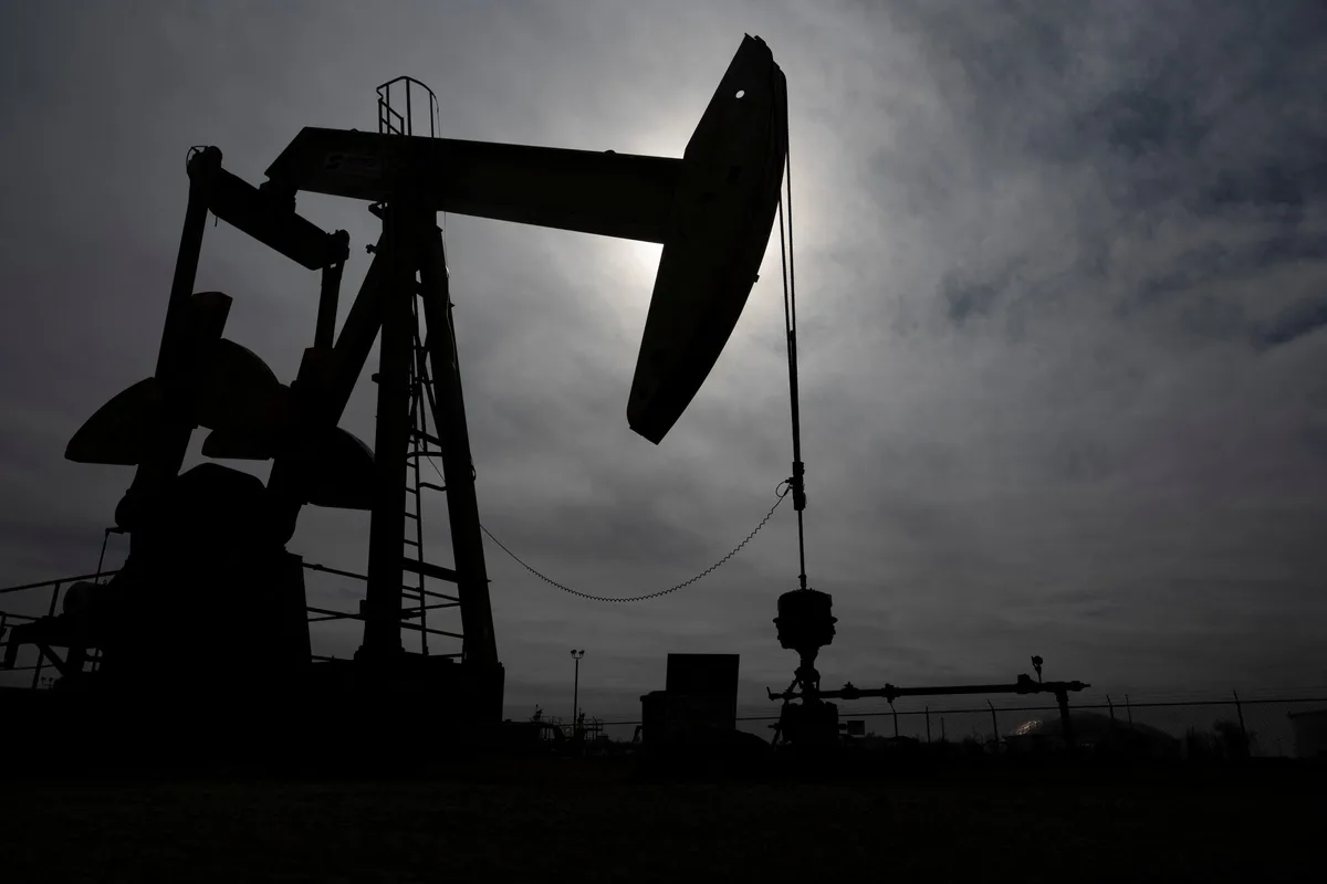 Oil falls on weaker demand outlook and higher U.S. stocks
