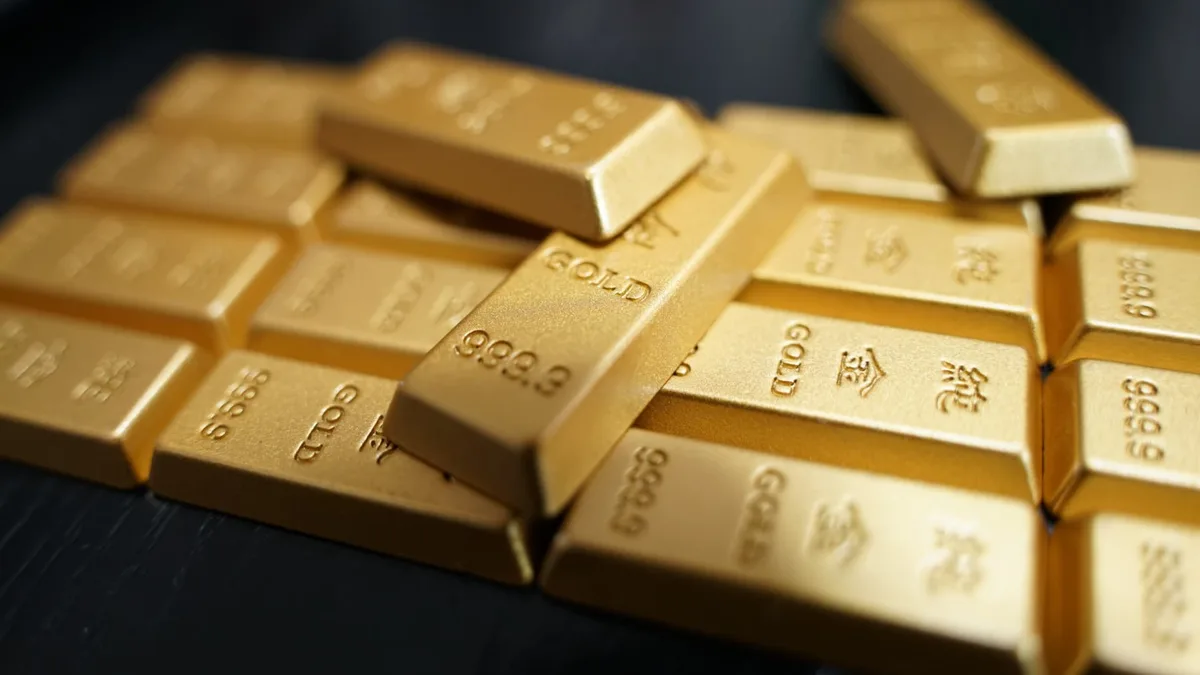Gold hits over three-month high on dollar weakness, Treasury bond buyback plans