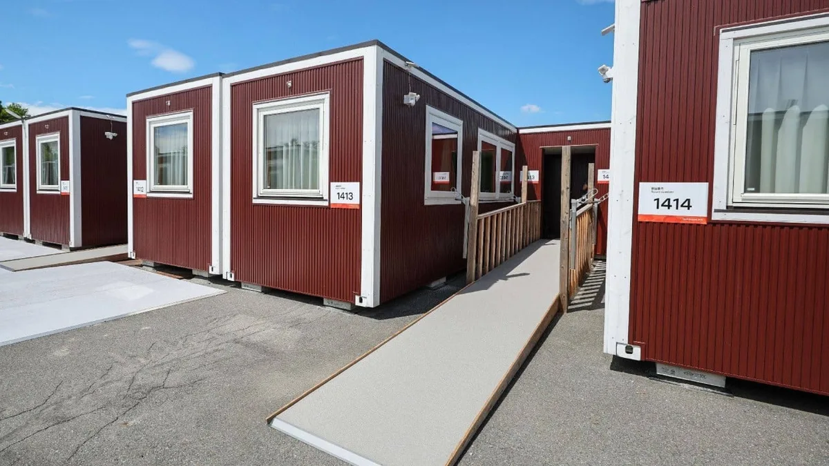 IOC president impressed by ‘beautiful’ Asian Games shipping container-style huts