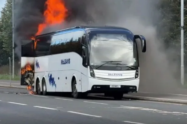 Football fans forced to evacuate team bus as it bursts into FLAMES after ‘vandalism’