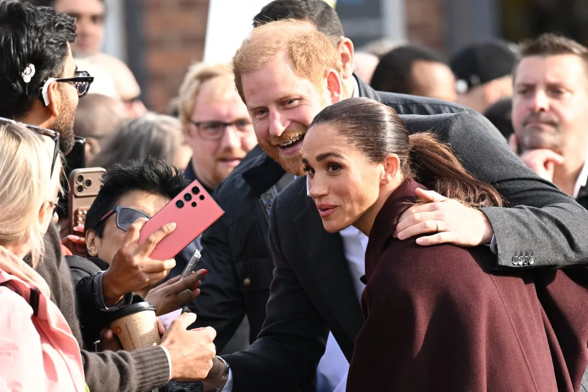 ‘It’s great to be back’: Harry and Meghan all-smiles at first joint engagement since return to UK