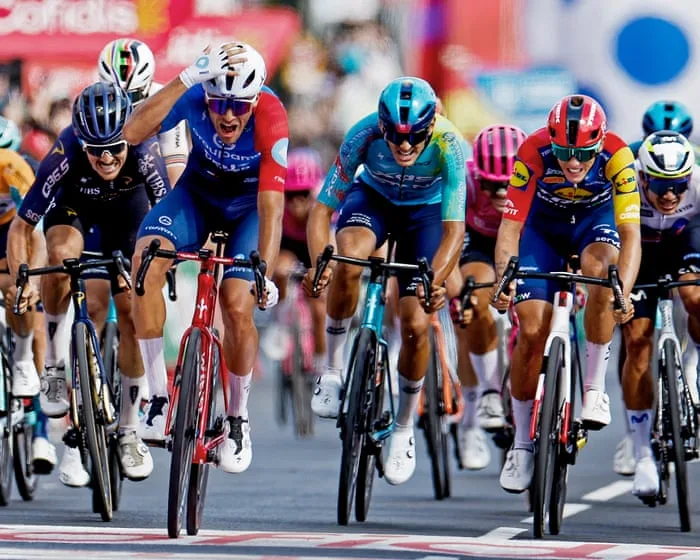 Vuelta a España: tearful Tronchon claims surprise stage victory in chaotic finish