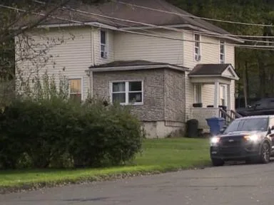 Police search home following double homicide at Great Wolf Lodge amid hunt for motive