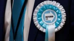 Reform suspends councillor ahead of court case