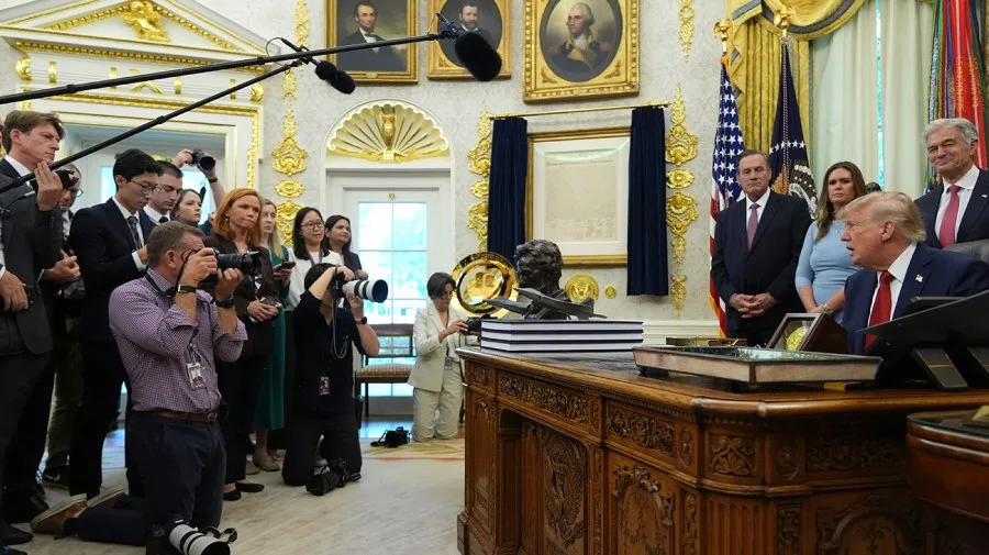 Trump floods the zone with press ban, triumphal arch, Kennedy Center