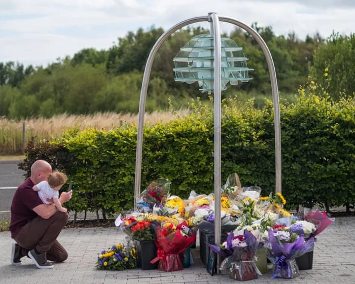 Five more arrested over crash that killed seven people including two police officers
