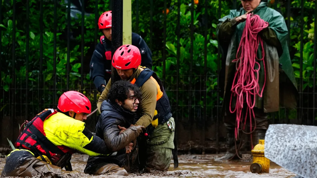 Heavy rain batters Chile’s capital, sweeping away cars and flooding homes