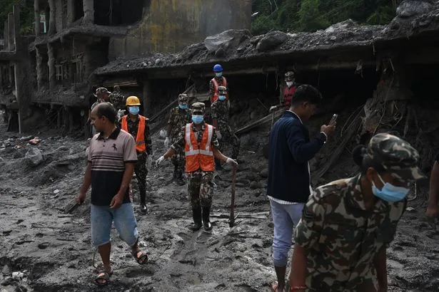 Brit pulled alive from rubble in Nepal almost one week after devastating floods