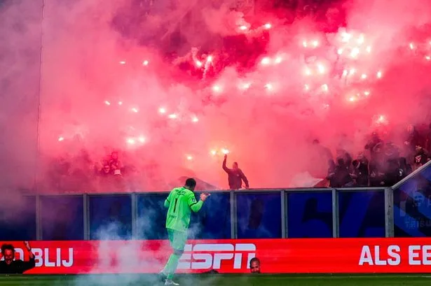 Fans burned and injured after fireworks thrown in shocking Dutch league match