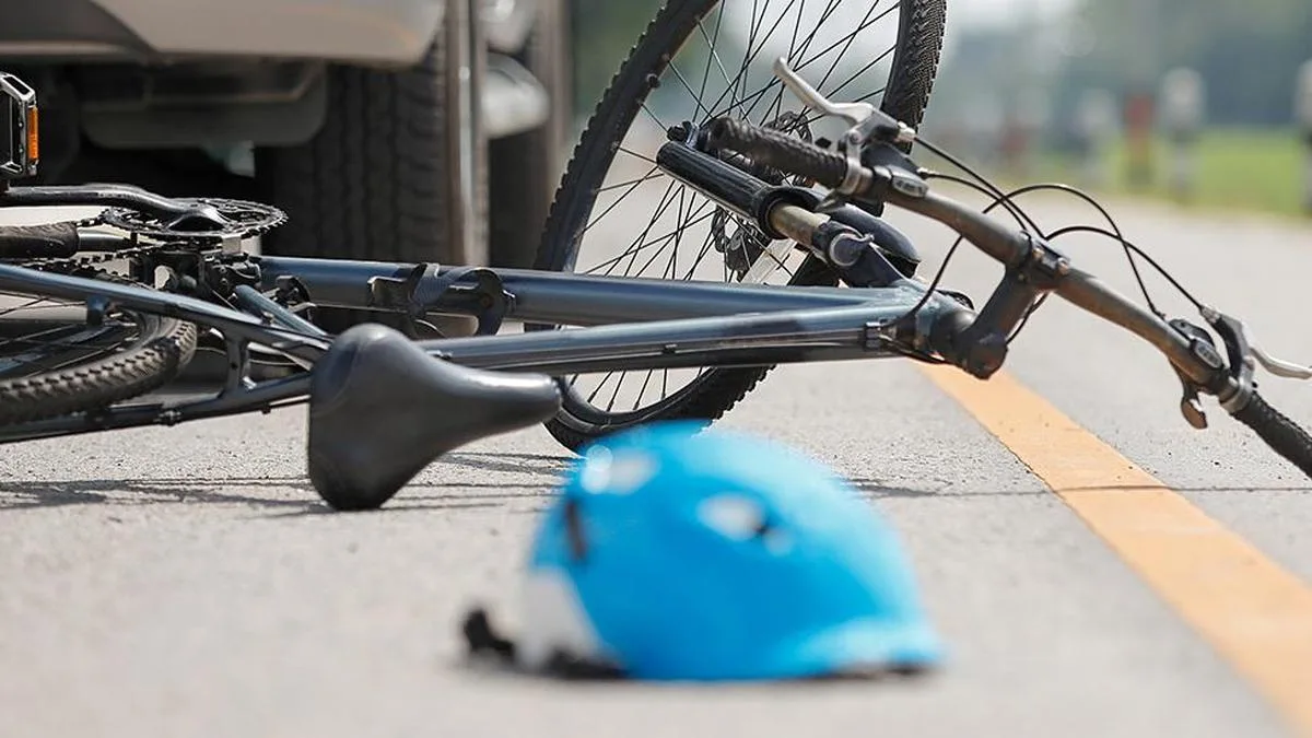 Young man drives car with helmet in Athani