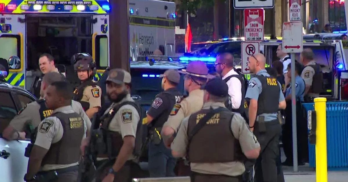 Police respond to downtown Minneapolis shooting that injured 2 officers, others