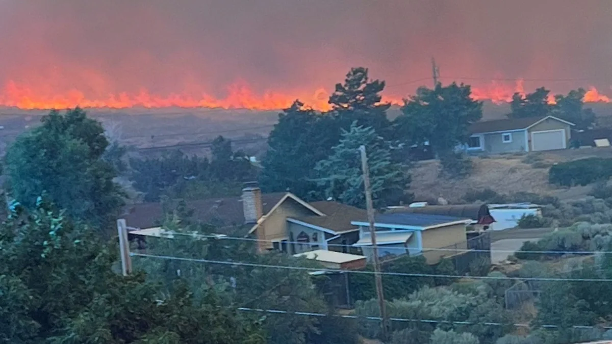 'Human-caused' wildfire rips through major city in Nevada - as 90,000 residents told to flee