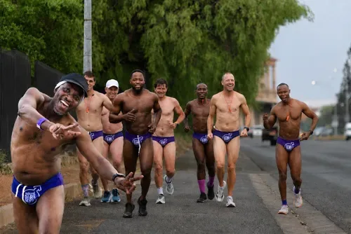 Speedos, sweat and serious business: Men run for cancer awareness