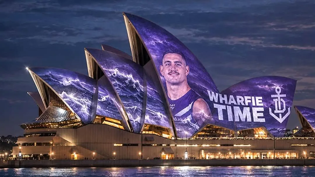 Western Australian Premier Roger Cook helps Fremantle Dockers take over Sydney with AI