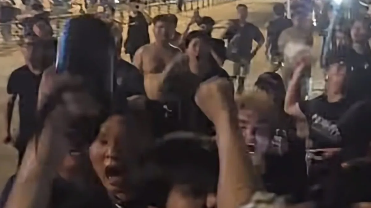 Angry Chinese Super League fans attack visiting team bus and make racist, offensive gestures