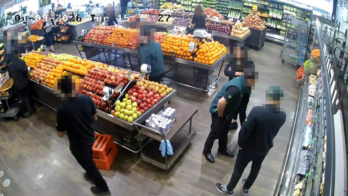 IGA owners accuse Woolworths of bullying after staff storm small shops in brazen act caught on CCTV