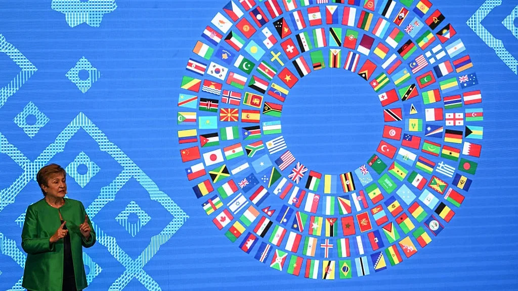 IMF warns of risks from AI boom and debt, but raises forecast for world growth