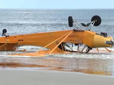 WATCH: Pilot rescued after banner plane crashes into Florida surf