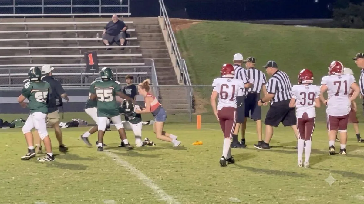 16-year-old girl runs onto field to tackle player and protect brother during game — watch
