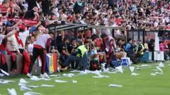 Rayo Vallecano game abandoned after paper plane protest