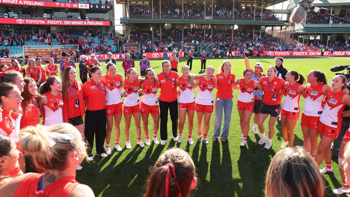 Swans AFLW team ride record support for Bombers win