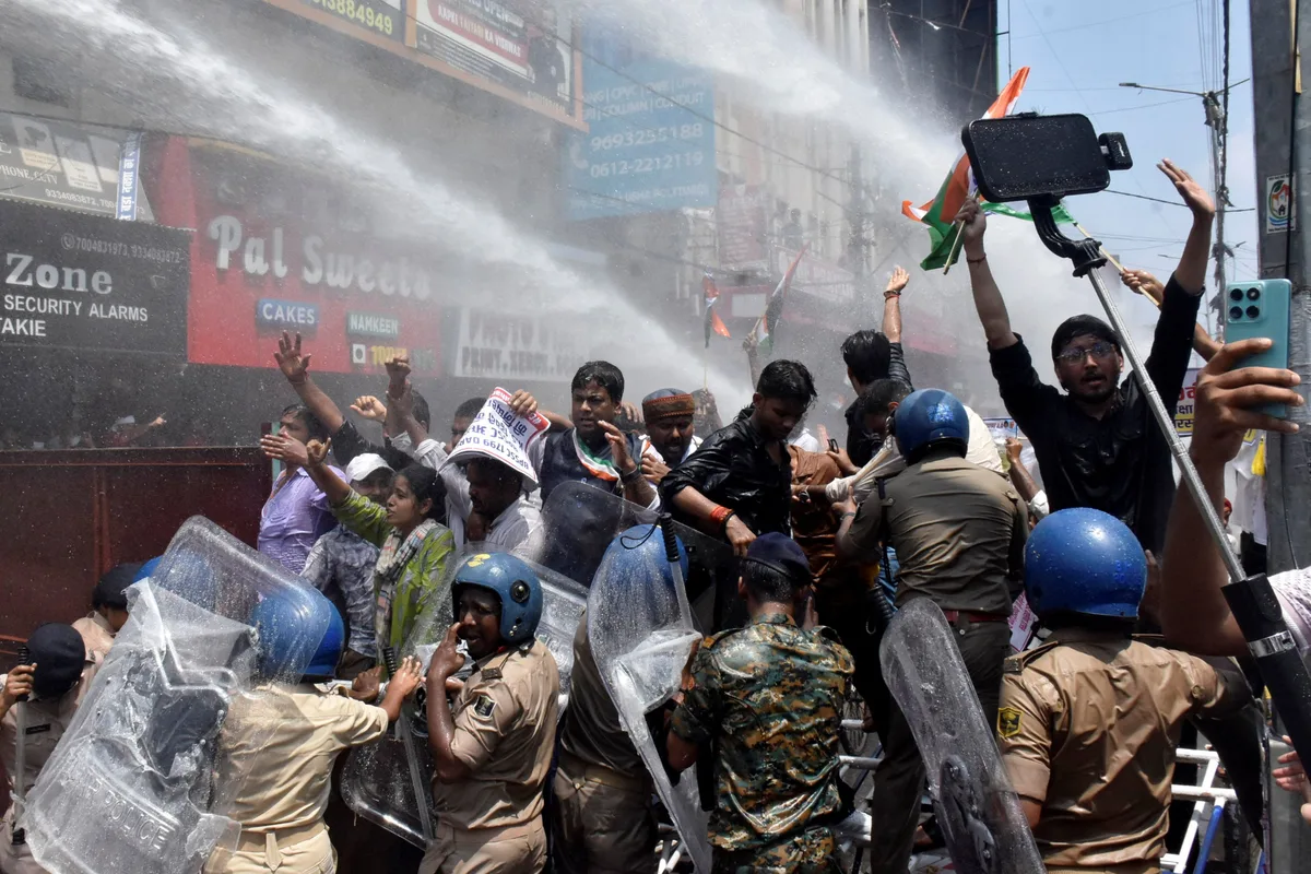 Indian police use water cannon at new protest over test paper leaks