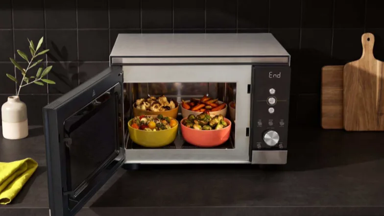 The new Ninja Crispi Microwave cooks and crisps enough food for 8 people — and it might make you want to to pull the plug on your full-sized oven