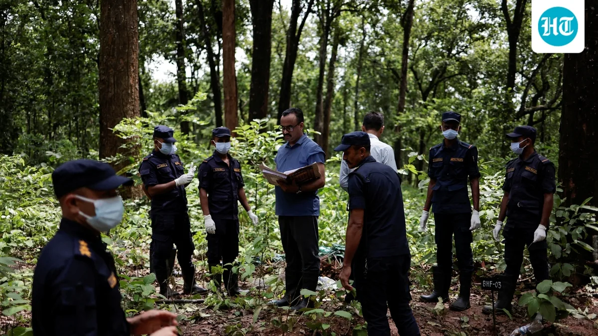 Nepal begins mass burial of unidentified flood victims; India sends forensic experts
