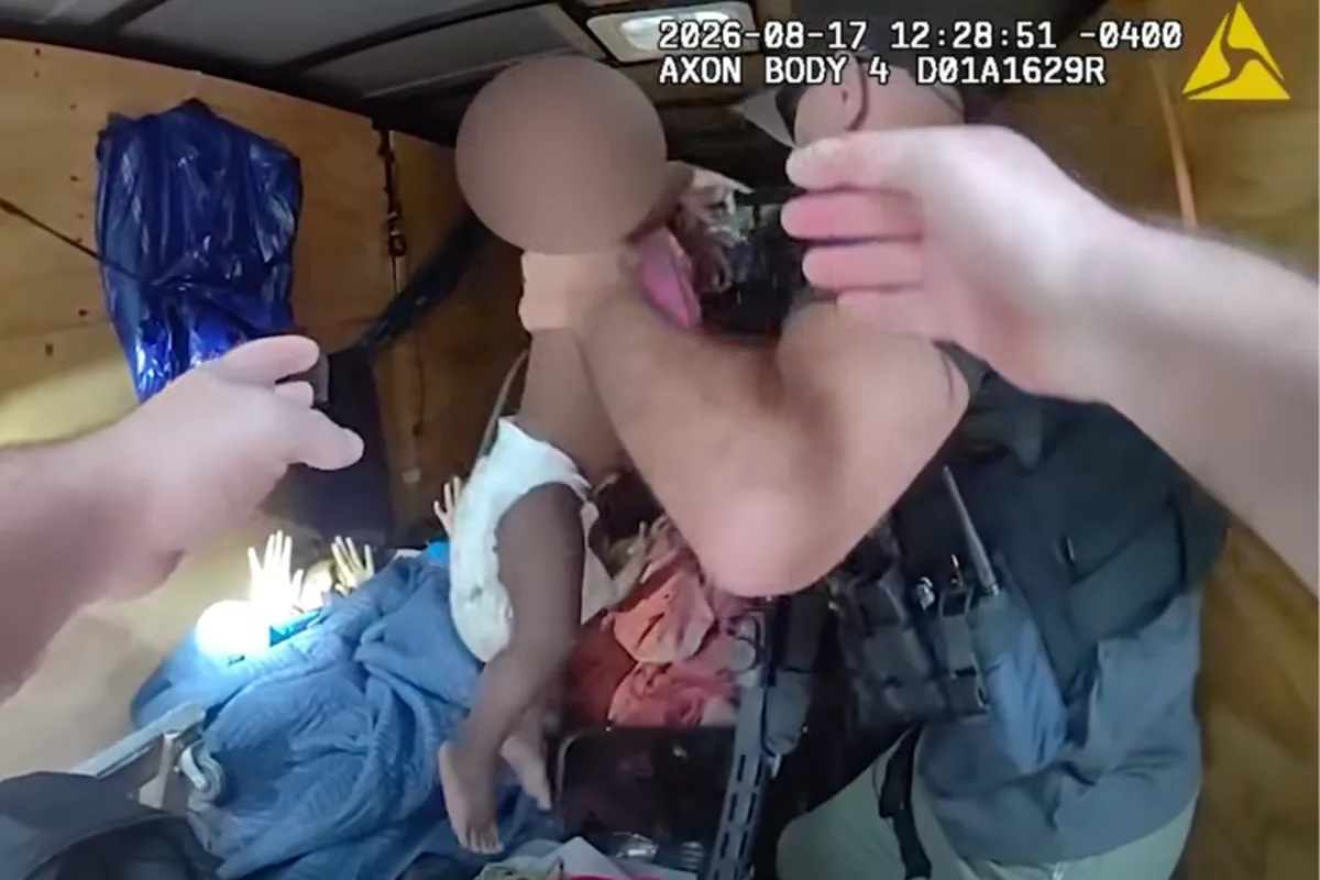 Dramatic footage reveals moment sisters, aged four and 11 months, rescued from trailer after Atlanta kidnapping