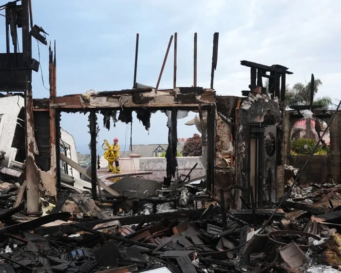 Six homes burned and two firefighters injured in fast-moving California wildfire