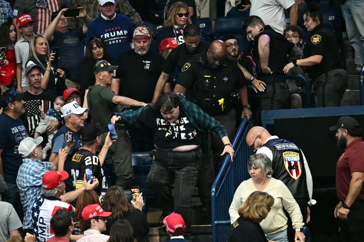 MAGA crowd pummels protester during Trump rally - and the internet wants her to sue