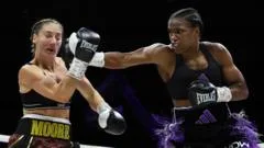 Dubois beats Moore to keep Baumgardner in picture
