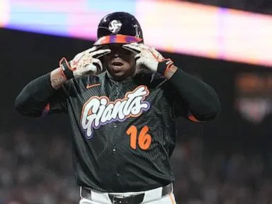 Rafael Devers bounces a homer into McCovey Cove as Giants beat Reds 3-1