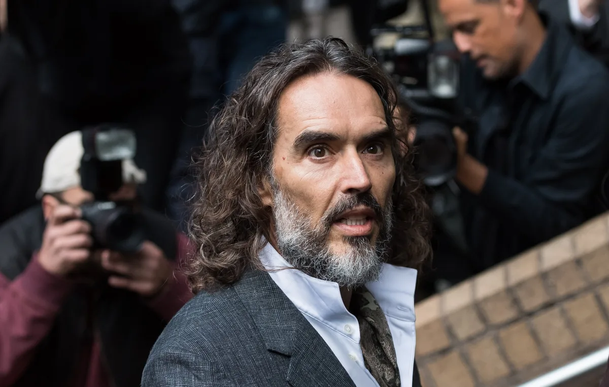 Russell Brand accused of being a “ruthless” sexual predator during first day of rape trial