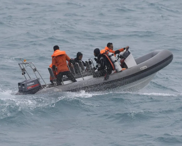 Indonesian rescue crews searching for 140 people after ferry hit bad weather