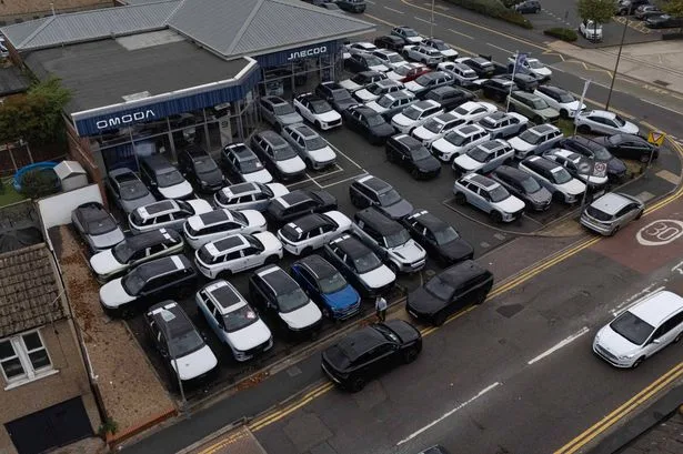 Locals furious as Chinese car dealership clogs up streets with extra parked cars