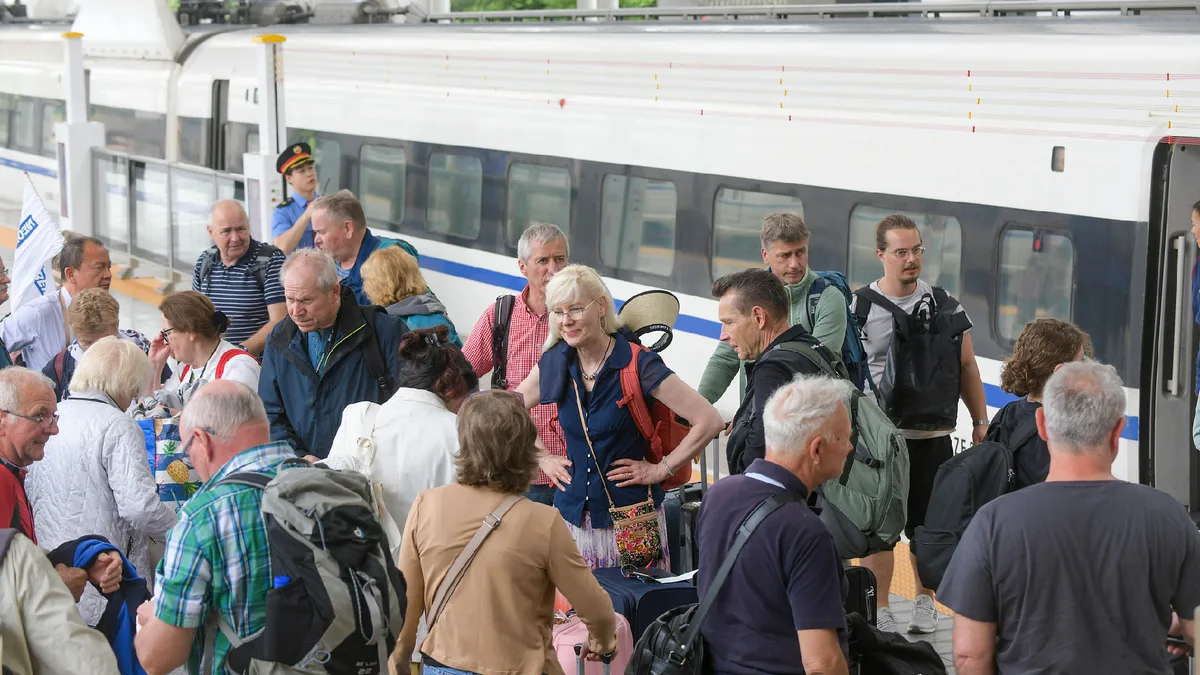China railway passenger trips hit record high in first eight months