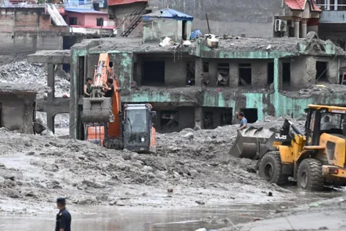 Rescuers claw through mud as Nepal, China flood missing toll nears 3,000