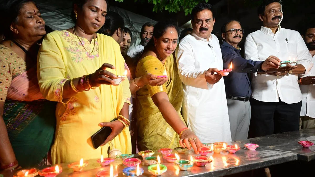 Jana Sena and TDP leaders light lamps in Vijayawada to mark Modi’s 25 years in public service