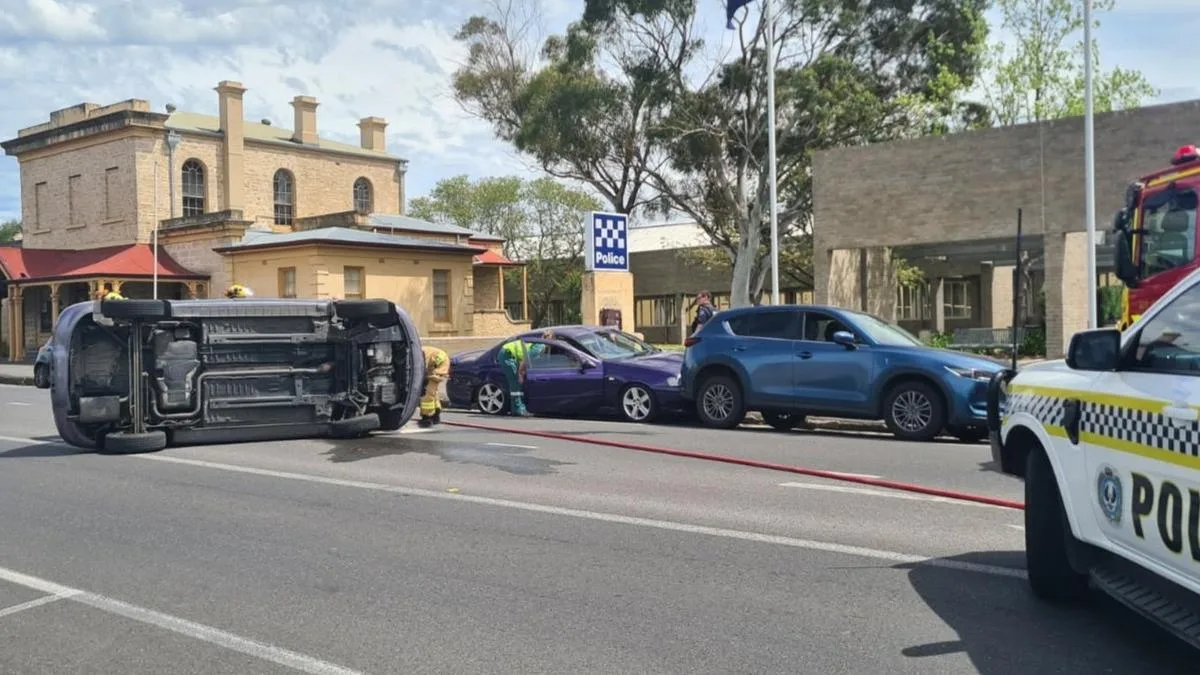 Multi-car pileup erupts directly outside South Australian police station after driver rolls car