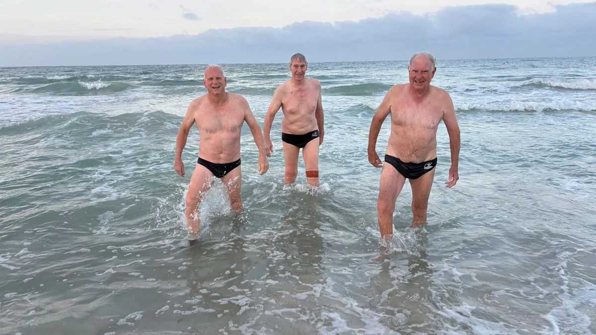 ‘Feel more vulnerable’: Swimmers return to Sorrento Beach, month after Greg O’Neil killed by shark