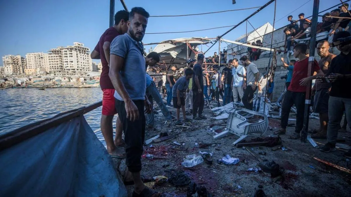 Israel kills six people at Gaza cafe and attacks Syrian airfield as US condemns ‘unnecessary escalation’