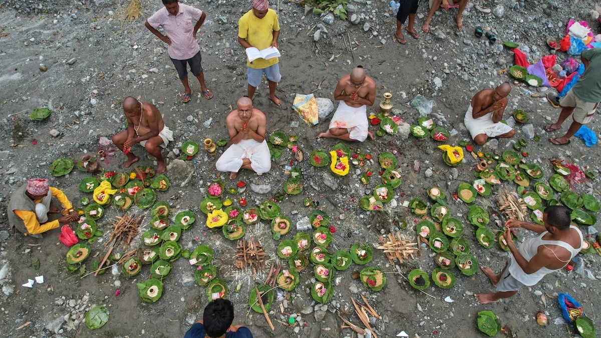 Symbolic funerals held in Nepal for those feared lost as some missing tourists make contact